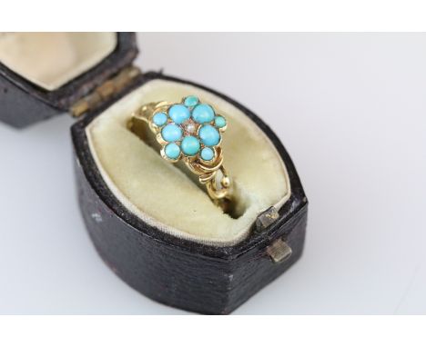 19th Century Victorian turquoise and seed pearl cluster ring having a cluster of cabochons to the head with pierced scrolled 