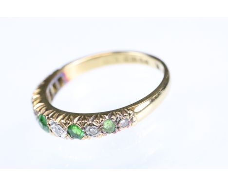 Green stone and diamond 18ct yellow gold ring, five graduated small round mixed cut green stones, possibly demantoid garnet, 