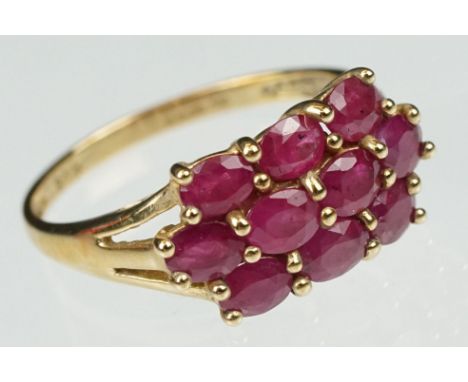 Ruby 9ct yellow gold ring, ten oval mixed cut rubies, shared claw settings, size of head approx 8.5 x 15mm, tapered pierced s