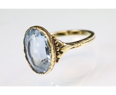 Blue topaz 14ct yellow gold ring, oval mixed cut topaz, dimensions approx 13.5 x 9.5mm, rubover claw set, cast scroll tapered