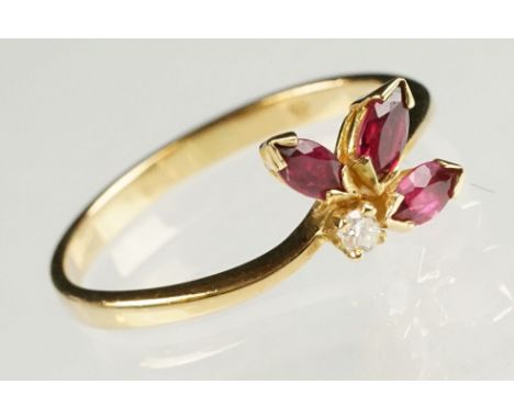 Ruby and diamond 18ct yellow gold ring, three marquise cut rubies, claw set, the principal ruby measuring approx 4 x 2.5mm, s