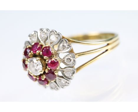 Ruby and diamond yellow and white metal three tier cluster ring, the principal round brilliant cut diamond weighing approx 0.