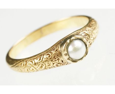 Mid 19th century pearl unmarked yellow gold ring, grey seed pearl, diameter approx 3.5mm, rubover set, the shoulders with eng