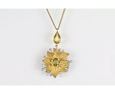 Citrine and diamond yellow and rose metal flower head pendant necklace, hexagonal mixed cut citrine to the centre, rubover se