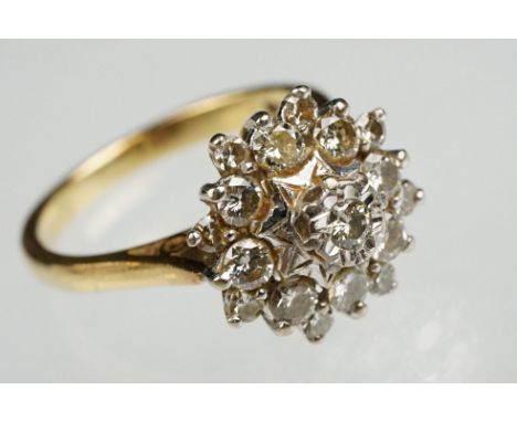 Diamond 18ct yellow gold cluster ring, round brilliant cut diamond to centre weighing approx 0.05 carat, illusion set, eight 