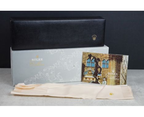Rolex - empty black leather watch box having a gilt embossed crown logo, suede lined interior, cloth and Cellini manual bookl