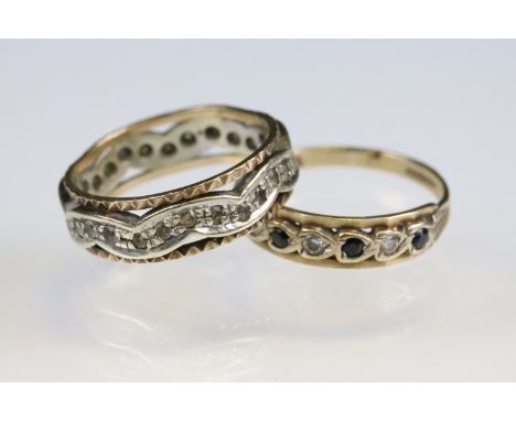 Two hallmarked 9ct gold rings to include a two tone full eternity ring set with white stones (Hallmarked London 1975, size N.