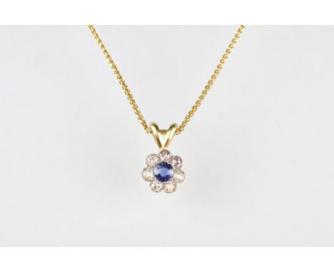 Sapphire and diamond 18ct yellow gold flower head pendant necklace, the round mixed cut sapphire to the centre diameter appro