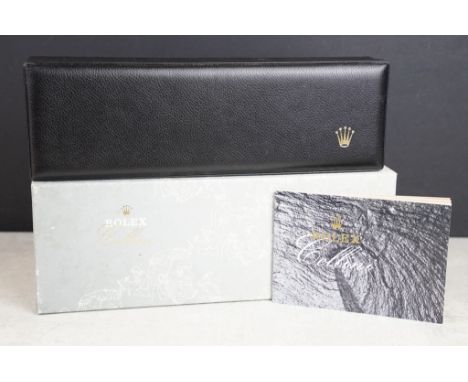 Rolex - empty black leather watch box having a gilt embossed crown logo, suede lined interior, cloth and Cellini manual bookl