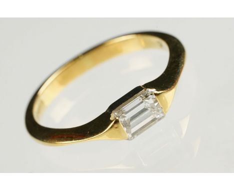 Diamond 18ct yellow gold ring, rectangular step cut diamond with truncated shoulders, measuring approx 3.95 x 5.51 x 2.83mm (