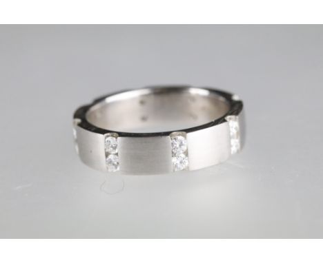 Diamond 18ct white gold eternity ring, sixteen small round brilliant cut diamonds in rows of two, channel set, total diamond 