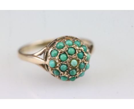 9ct gold and turquoise cluster ring having a domed head set throughout with turquoise cabochons. Hallmarked London 1964. Size