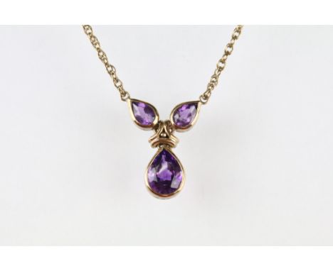 Amethyst 9ct yellow gold necklace, three graduated pear shaped amethyst, the largest measuring approx 9 x 7mm, rubover set, s