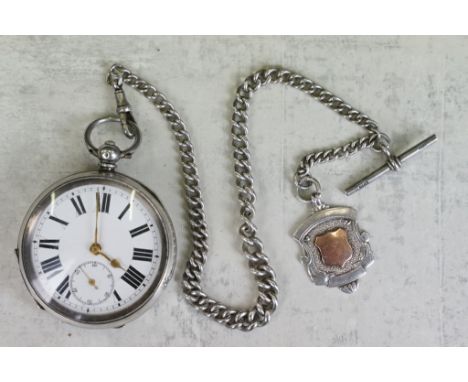 Silver open face key wind pocket watch, white enamel dial and seconds dial, black Roman numerals, the internal dust cover eng