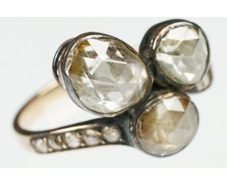 19th century diamond unmarked gold and silver set ring, three oval rose cut diamonds, the principal diamond measuring approx 