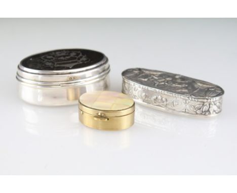German silver snuff pill box of oval form with neo classical cherubs and urns to the lid (marked with crescent and crown, SR 