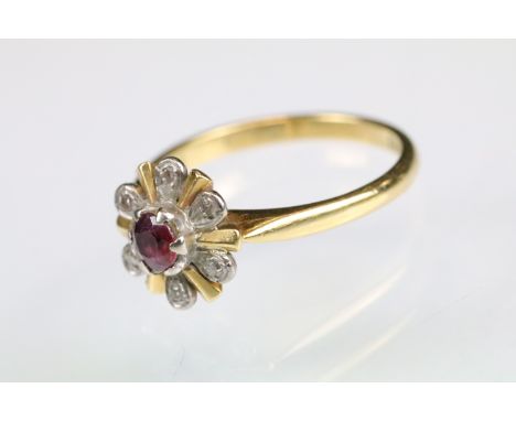 Ruby and diamond 18ct yellow and white gold set cluster ring, small round mixed cut ruby to centre, diameter approx 3.5mm, si