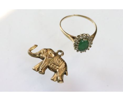 9ct yellow gold elephant charm; together with an emerald and diamond yellow metal cluster ring (emerald chipped, band cut) (a