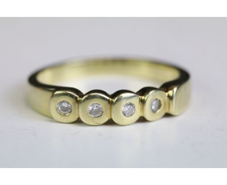 Diamond 14ct yellow gold ring, four small round brilliant cut diamonds, flush set, tapered shoulders, ring size N½