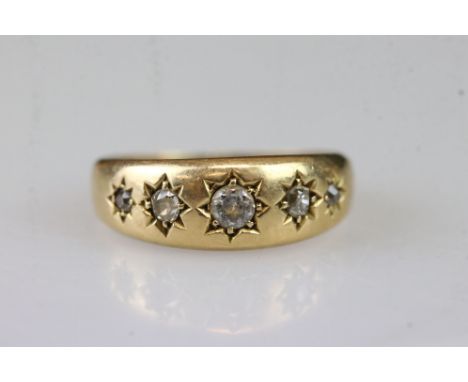 18ct gold and diamond five stone ring having five round cut diamonds in star settings. Hallmarked Birmingham 1888. Size K. 