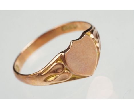 9ct rose gold signet ring, vacant shield shaped cartouche, tapered shoulders, ring size N, hallmarked Birmingham 1924 