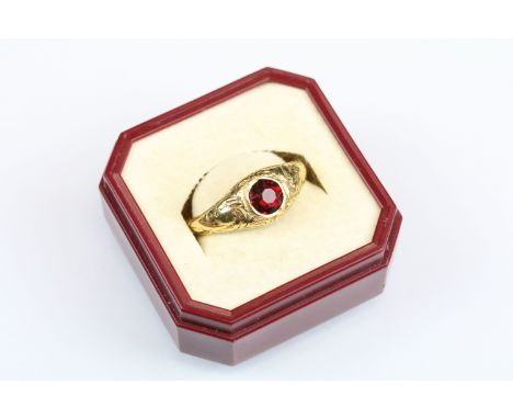 19th Century Victorian 18ct gold and garnet mourning ring. The ring being set with a round cut garnet on tapering shoulders w