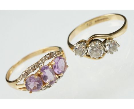 Amethyst 10ct yellow and white gold set three stone ring, two small rose cut diamond accents, tapered shoulders, ring size N;