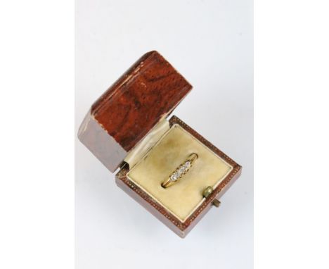 Diamond yellow metal ring, five small rose cut diamonds, claw set, tapered shoulders, ring size K½ 
