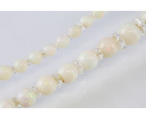 Pearl and rock crystal necklace, sixty-four graduated round precious white opal beads, displaying violet, indigo, green, yell