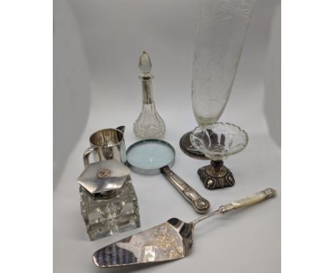 A collection of silver items to include a milk jug, perfume bottle, 2 vases, Aspreys ink well (glass A/F), magnifying glass, 