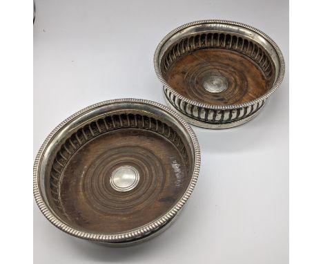 A pair of Georgian silver wine coasters, hallmarked, 1800-1810, John Roberts &amp; Co. D.14.5cm