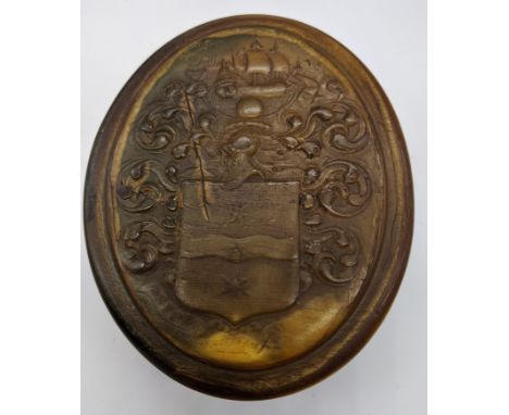 Attributed to John Obrisset, a Queen Anne oval shaped horn snuff box, impressed with the arms of Sir Francis Drake, inscribed