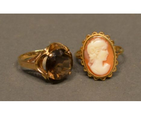 A 9ct. Gold Citrine Set Dress Ring, Together With Another Similar 9ct. Gold Cameo Ring 