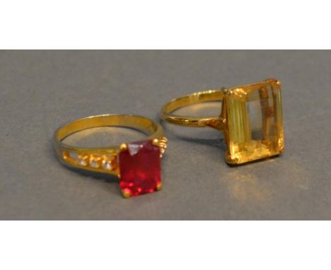 A 9ct. Gold Dress Ring The Pink Stone Flanked By Diamonds, together with an 18ct. gold citrine set dress ring 