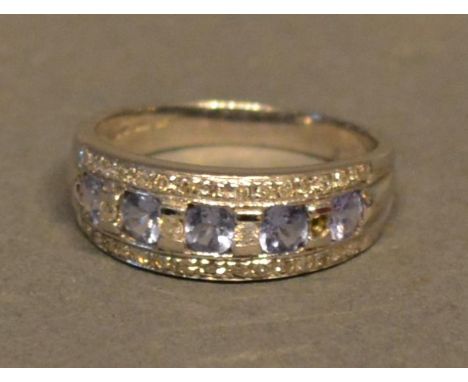 A 9ct White Gold Tanzanite and Diamond Band Ring 