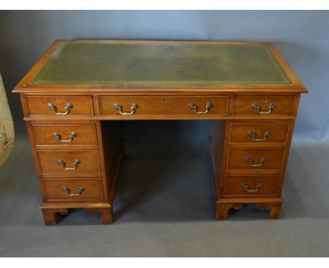 A Reproduction Mahogany Twin Pedestal Desk, The Green Tooled Leather Inset Top above nine drawers with brass handles, raised 