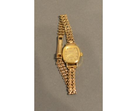 A 9ct. Gold Cased Ladies Wrist Watch By Tissot With Associated 9ct. gold strap, 14.7g all in 