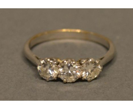 A White Metal Three Stone Diamond Ring Claw Set 