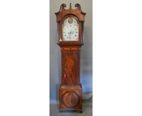 A George III Mahogany Long Case Clock, the arched hood with swan neck pediment above a shaped door and conforming plinth base