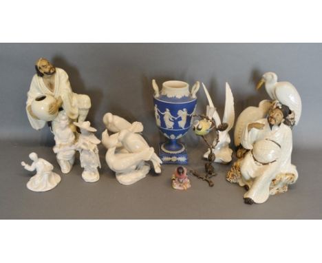 A Wedgewood Jasper Ware Two Handled Pedestal Vase, decorated in relief with classical figures, 22cm tall, together with a Roy