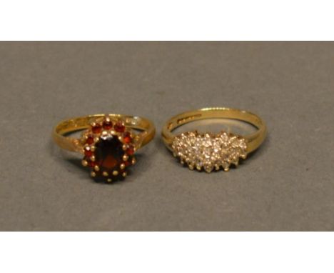 A 9ct. Garnet Set Cluster Ring, Together With Another 9ct. Gold Diamond cluster band ring 