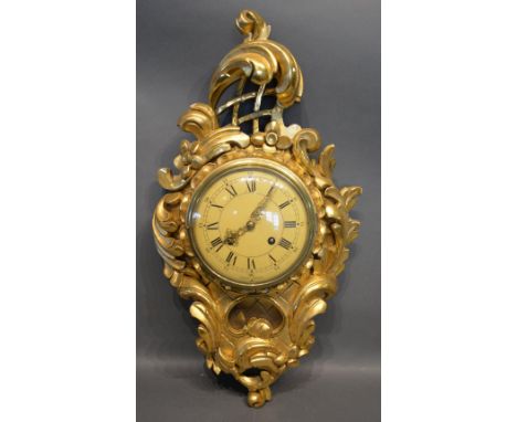 A Gilt Wood Cartel Clock Of Carved Scroll Form, 58cm long 