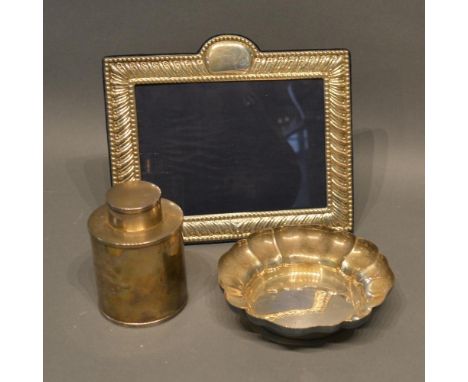 A Rectangular London Silver Photograph Frame, Together with a London silver tea caddy and a Birmingham silver bowl 