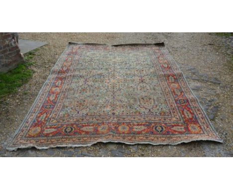 A North West Persian Woollen Carpet With An All Over Design upon a blue, cream and red ground within multiple borders, 310cm 