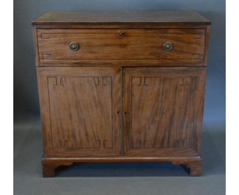 A Regency Mahogany Secretaire Side Cabinet The Reeded Top above a fully fitted secretaire drawer and two cupboard doors, rais