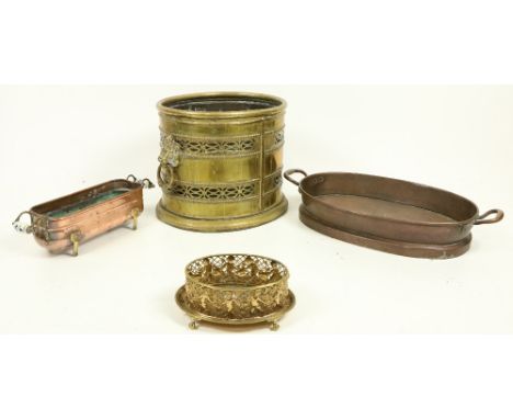A heavy oval pierced brass Wastepaper&nbsp;Bin or Turf Holder, with lion mask and ring handles, 12"h x 16"w (31cms x 41cms); 