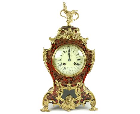 A fine quality French Mantel Clock, with boulle case and overall ormolu rococo mounts with pierced decorated panels, enamel d
