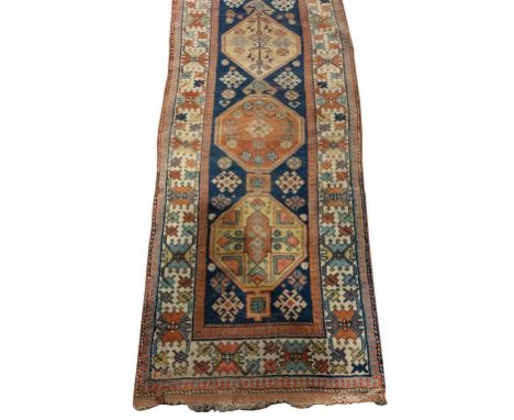 A fine quality antique Carpet / woollen&nbsp;Runner, the central dark blue ground panel with eight medallions surrounded by a