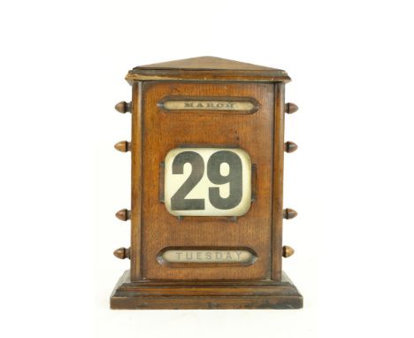 A desk top Edwardian roller perpetual Calendar, in oak case, 10" (25cms). (1)