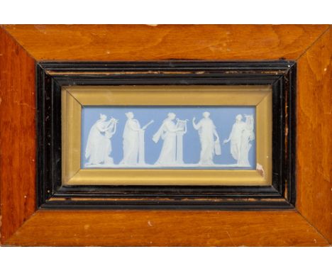 A large blue and white Jasperware Wedgwood Panel, with dancing classical women in relief, 15cms x 47cms&nbsp; (6" x 18 1/2"),